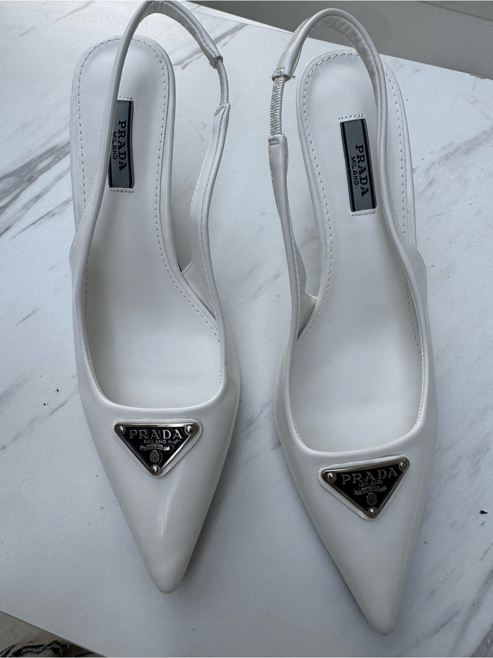 Prada White Patent Leather Pointed Slingback Pumps with Logo Plaque
